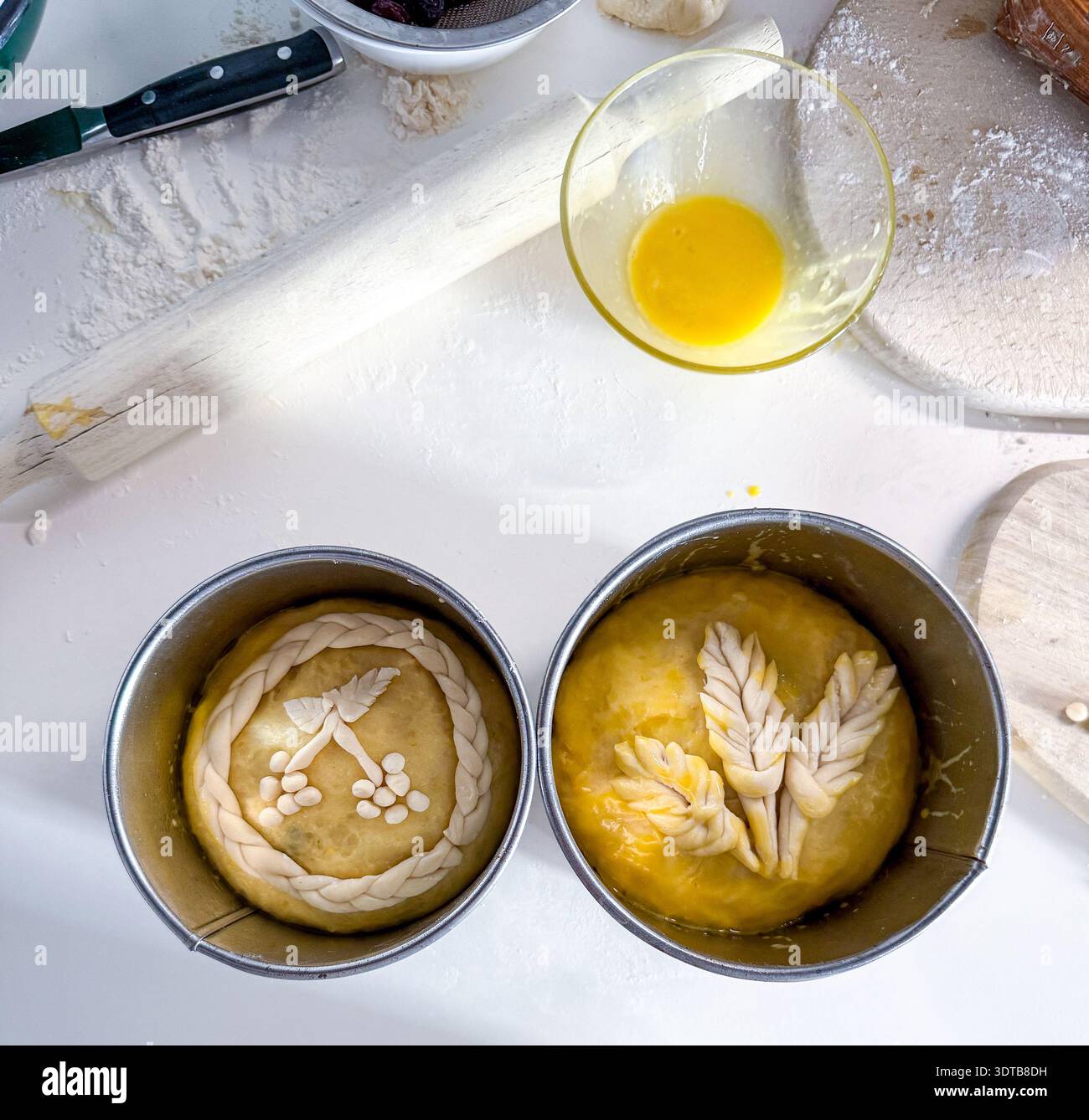 Preparing easter bread dough decorated with wheat and berries Stock Photo