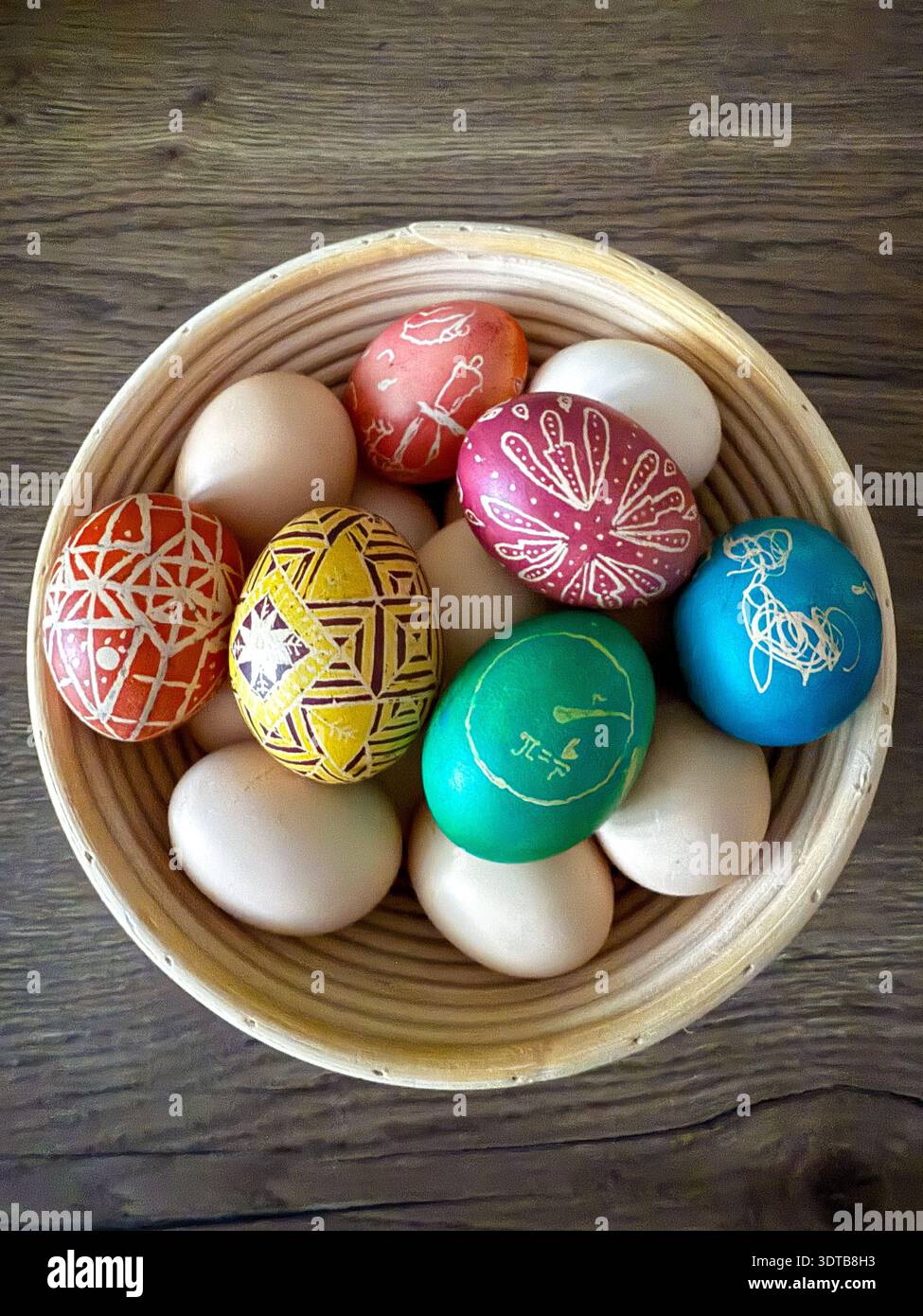 Easter eggs decorated with pysanky patterns in basket Stock Photo