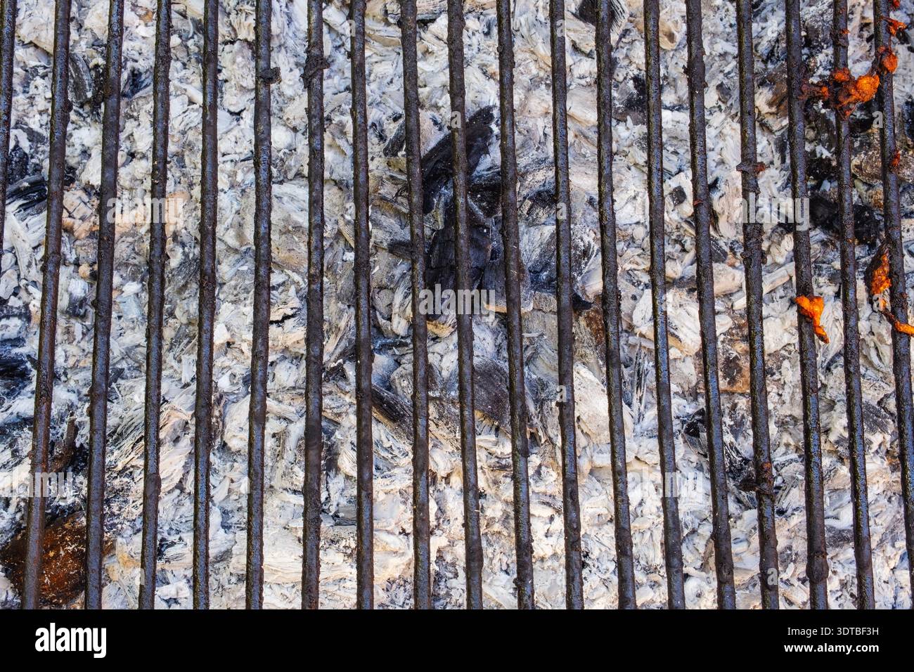 Used charcoal briquettes on barbeque grill Stock Photo