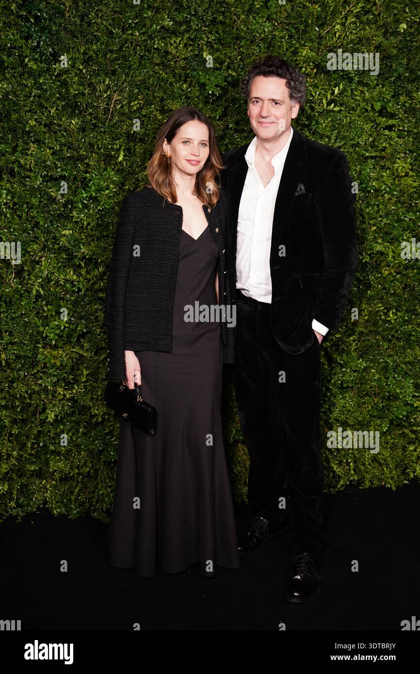 Felicity Guard Felicity Jones (left) and Charles Guard arriving for the Charles Finch ...