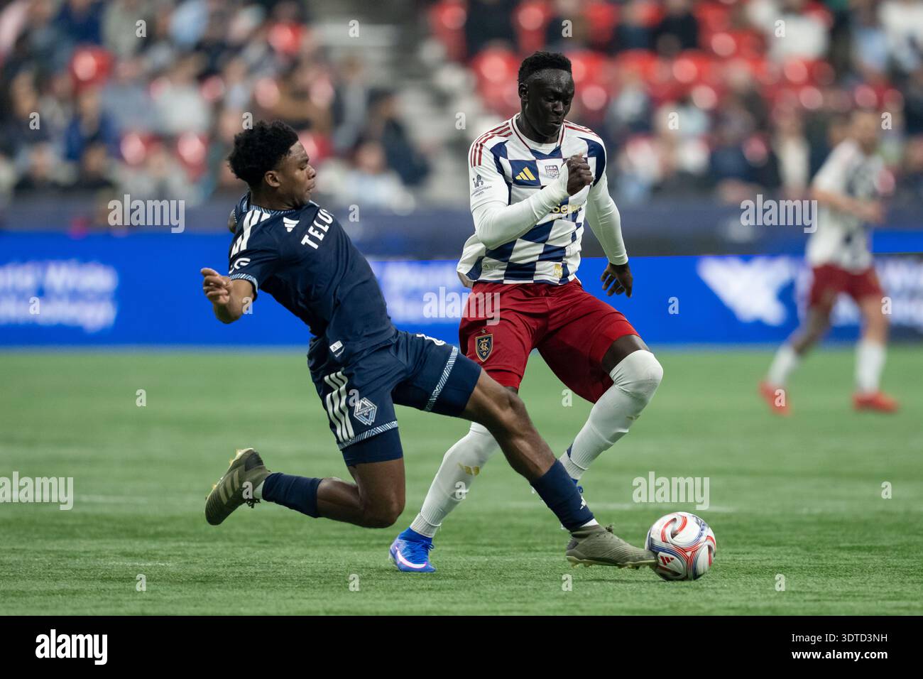 Vancouver Whitecaps' Ralph Priso (left) and Real Salt Lake's Ariath ...
