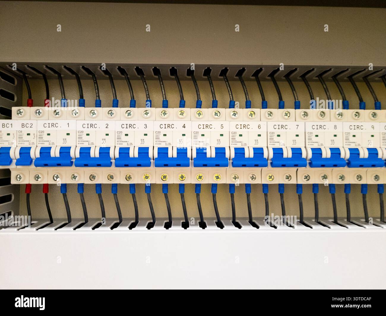 Industrial electrical control panel with wiring and circuit breakers Stock Photo