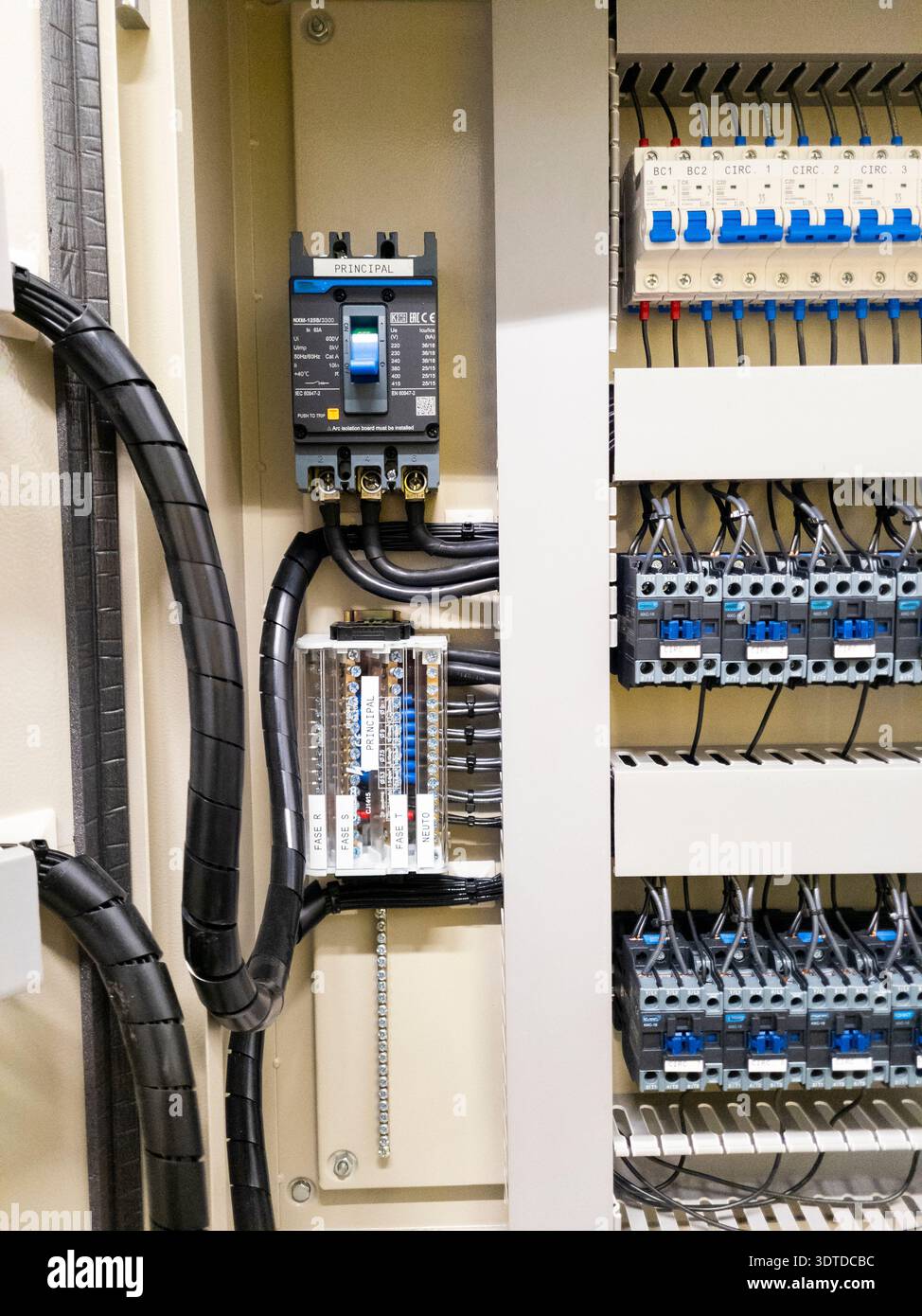 Industrial electrical control panel with wiring and circuit breakers Stock Photo
