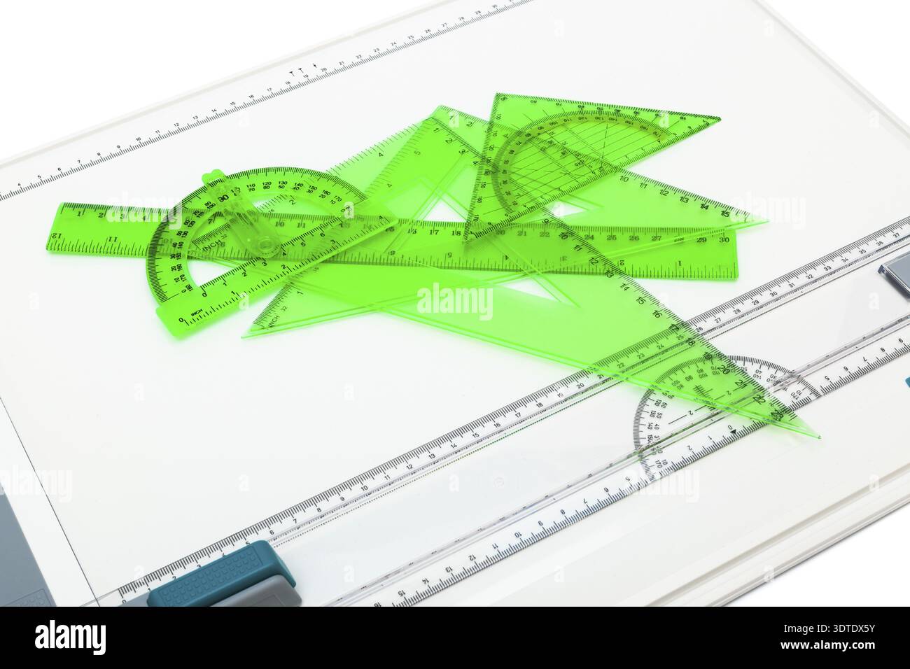 Drawing board with measuring instruments on a white background Stock Photo
