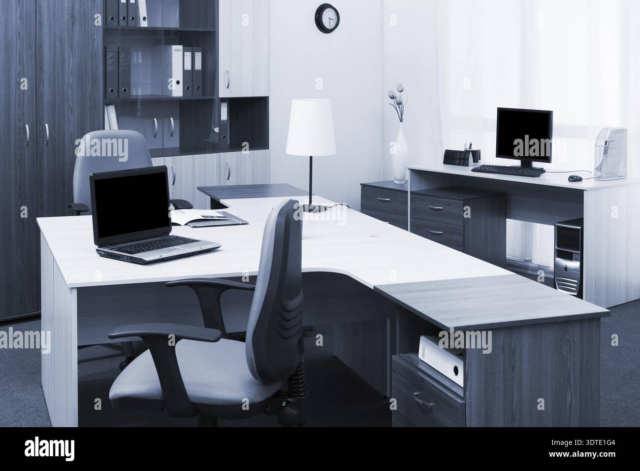 Workplaces with computers in a modern office Stock Photo
