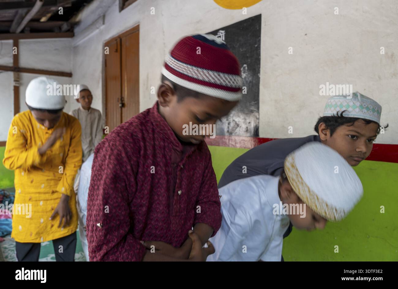 Muslim children devotees offer prayers on the first Friday of the holy ...