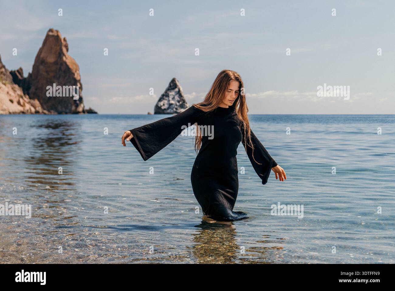 Woman in dress wading in water hi-res stock photography and images - Alamy
