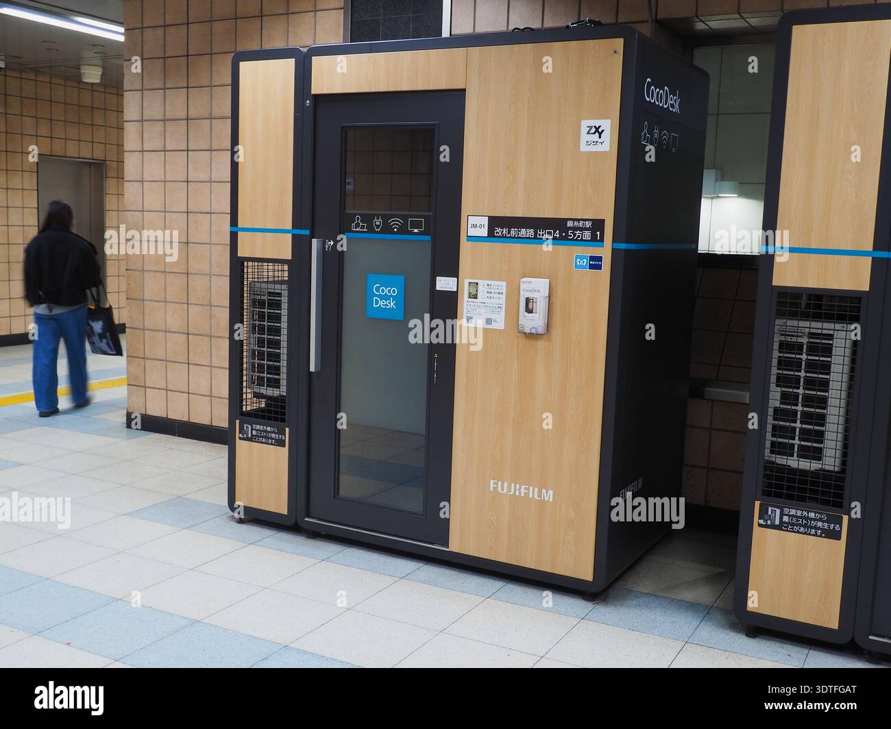 Coco Desk rental work pods inside a Tokyo subway station. They are