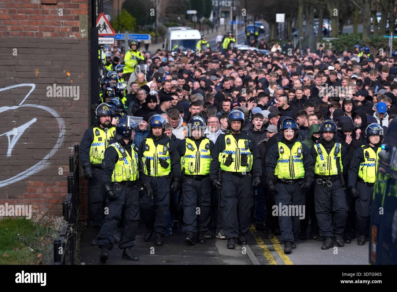Police officers escort Sheffield Wednesday fans to the ground ahead of ...