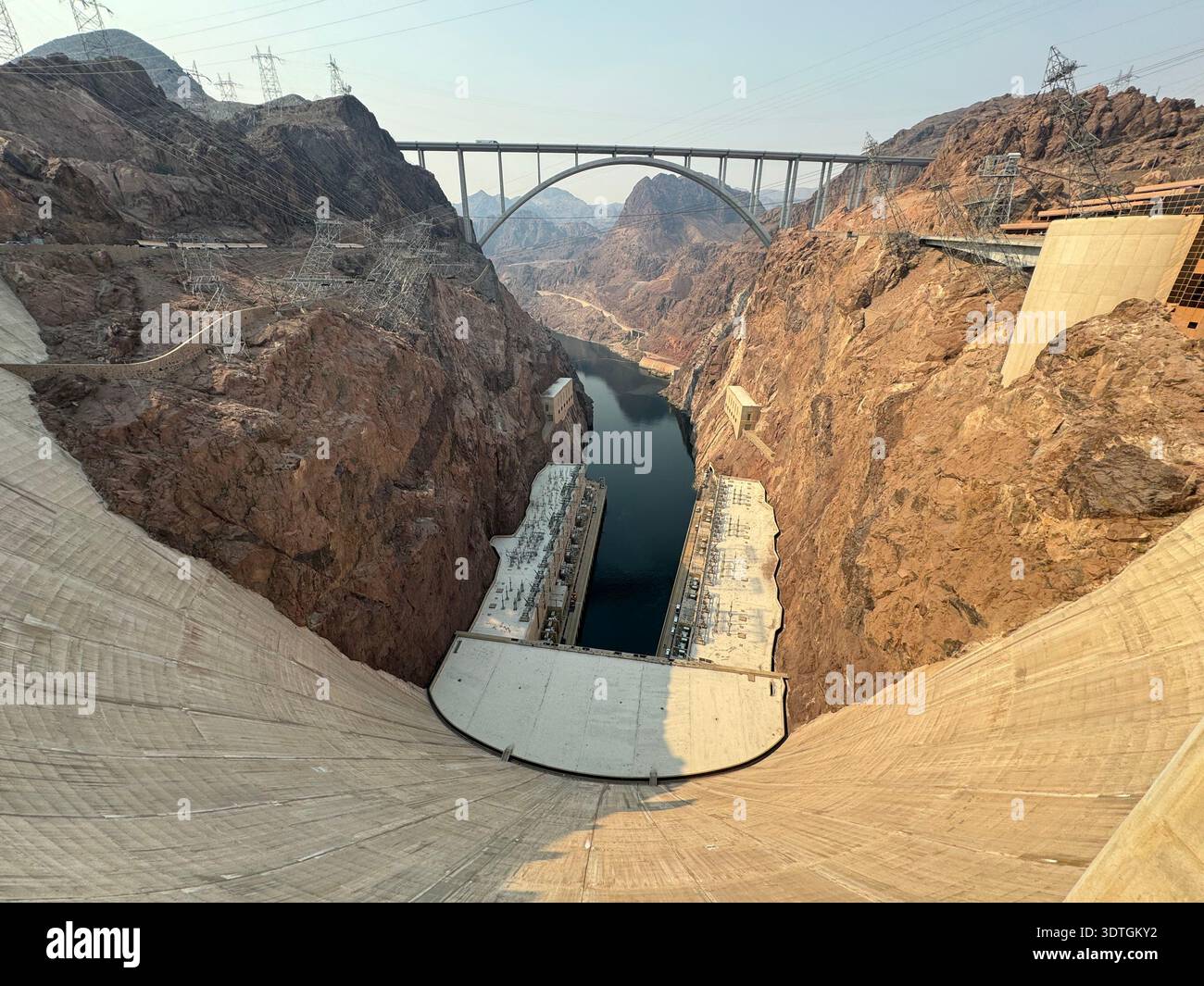 View from the top of Hoover Dam looking toward the Colorado River and Mike O'Callaghan–Pat Tillman Memorial Bridge spanning Black Canyon b - Smartphone Captured Stock Image