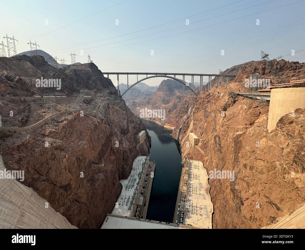 View from the top of Hoover Dam looking toward the Colorado River and Mike O'Callaghan–Pat Tillman Memorial Bridge spanning Black Canyon b - Smartphone Captured Stock Image