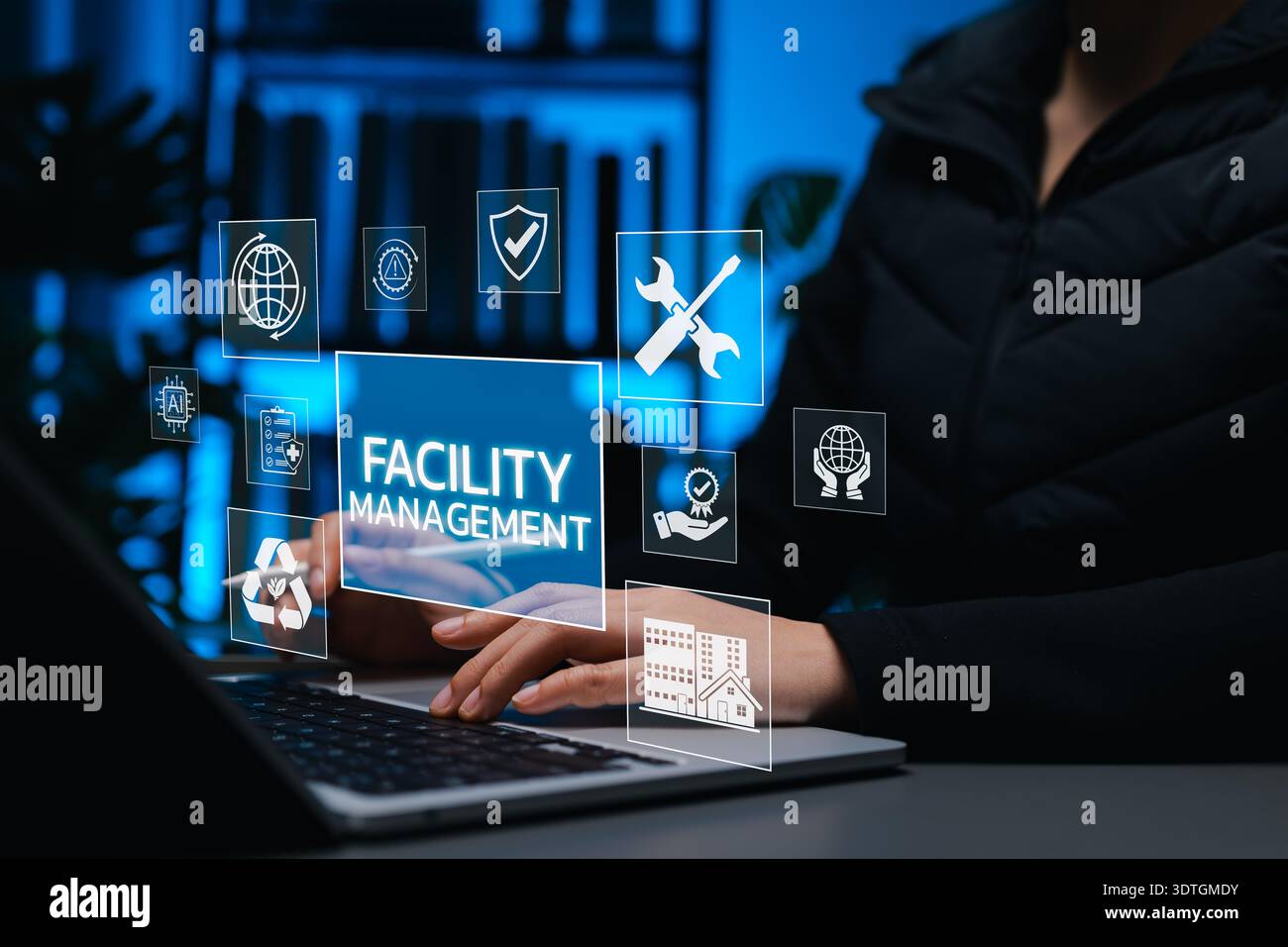 Facility Management Concept. Professional works on laptop with digital ...
