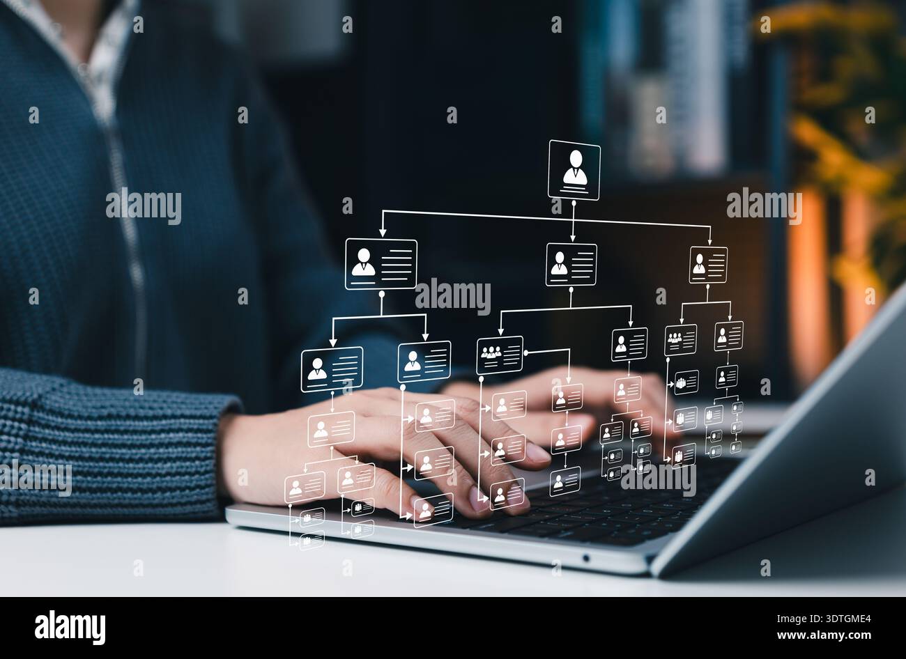Organizational structure concept. professional using laptop with hierarchy chart representing corporate management system, team structure, workflow Stock Photo