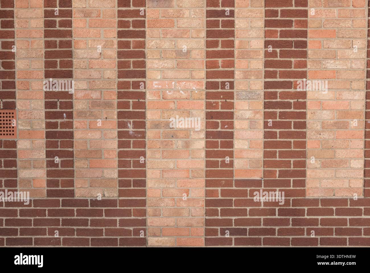 a brick wall using two different colour/colors brick,s to make the pattern wall uk Stock Photo