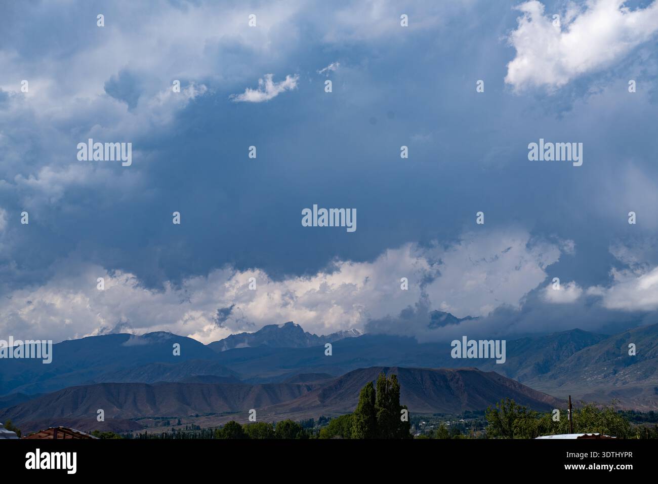 Clouds over mountain peaks in Kyrgyzstan Stock Photo