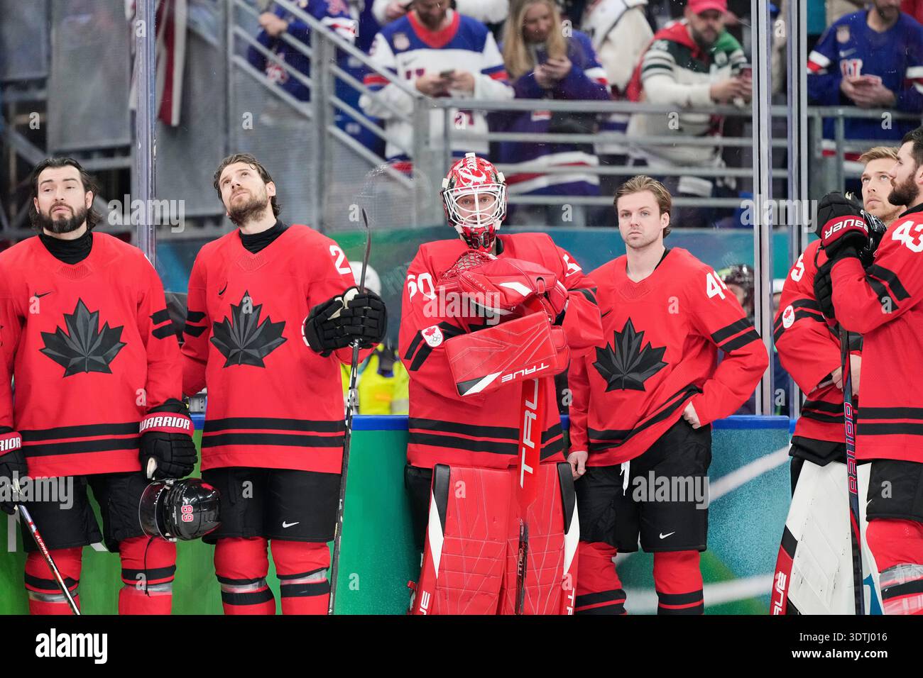 Canada players react after being defeated during a men's ice hockey ...