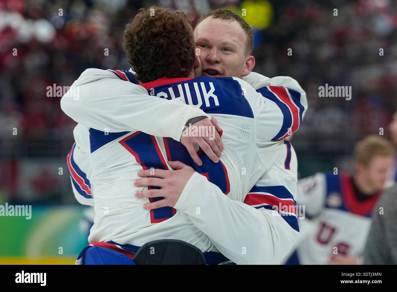 United States' Matthew Tkachuk, left, embraces United States' Brady ...