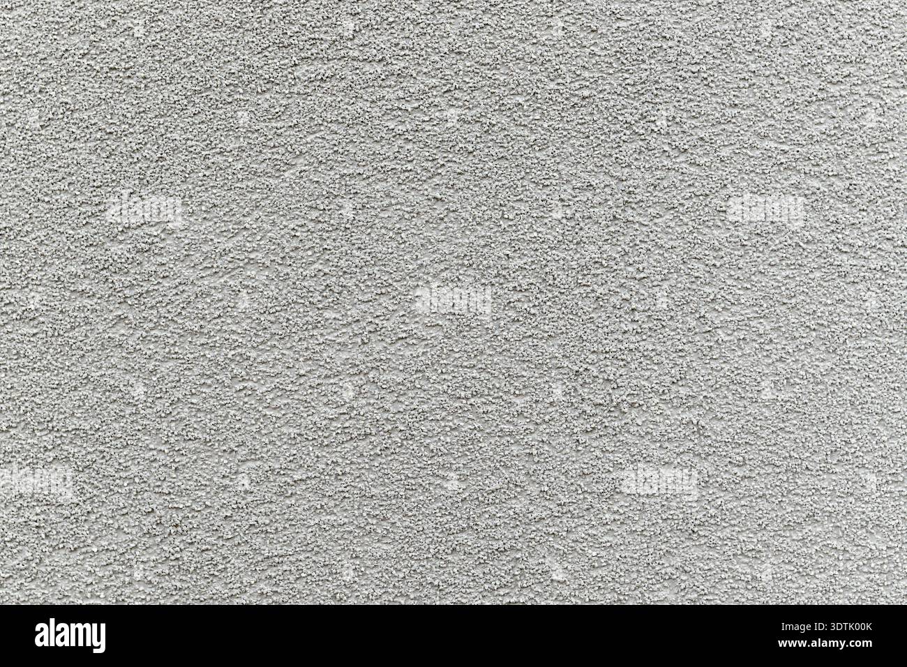 Textured gray roughcast plaster wall as background Stock Photo