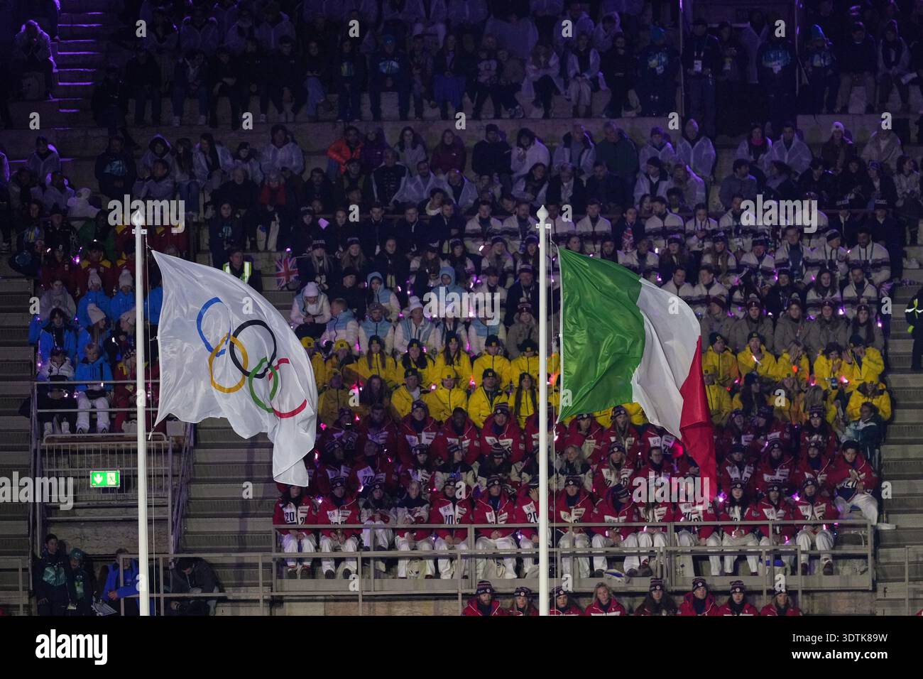 The Olympic and the Italian flag wave during the closing ceremony of ...
