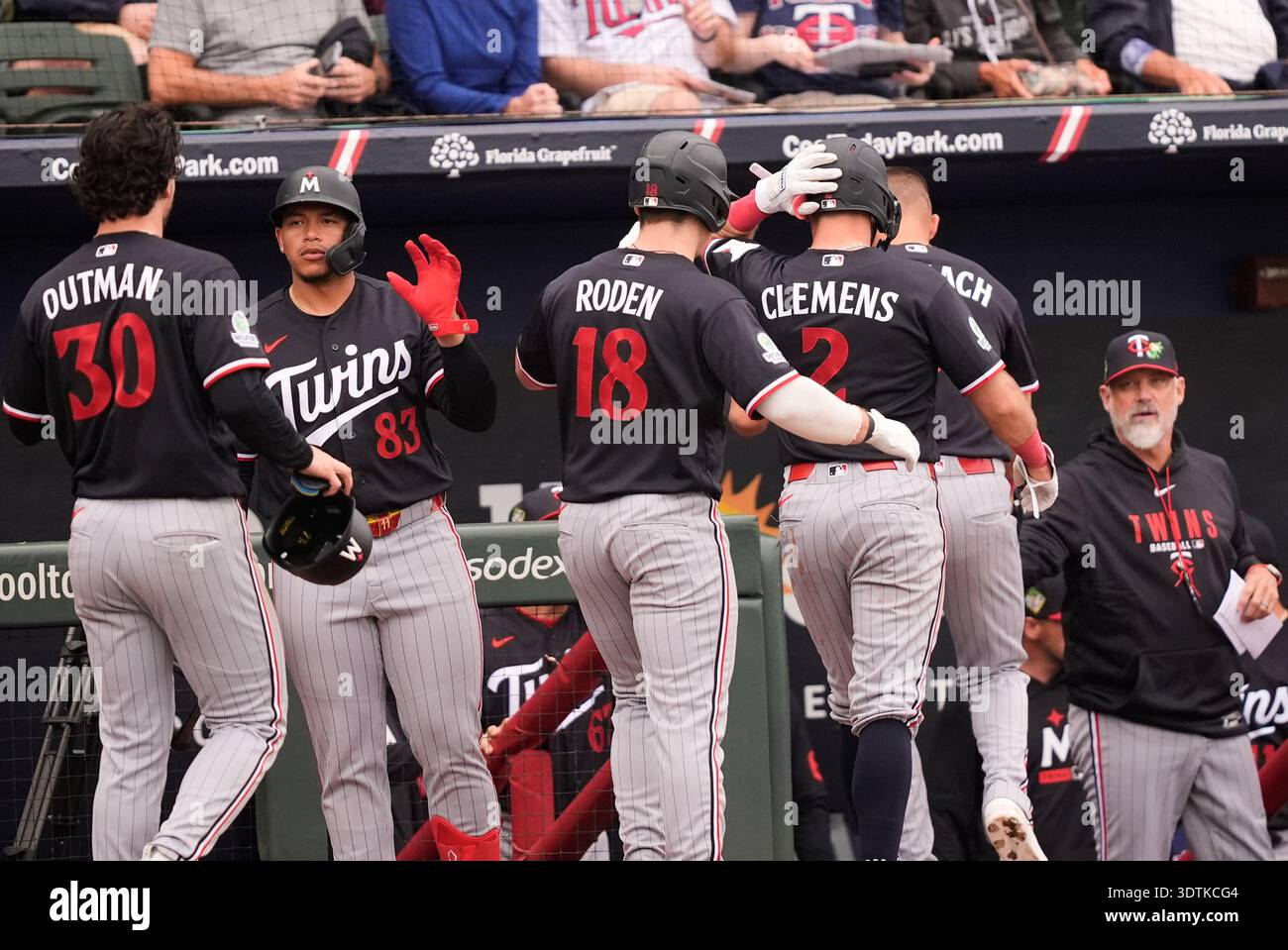Minnesota Twins Alan Roden (18) is greeted at the dugout with Trevor ...