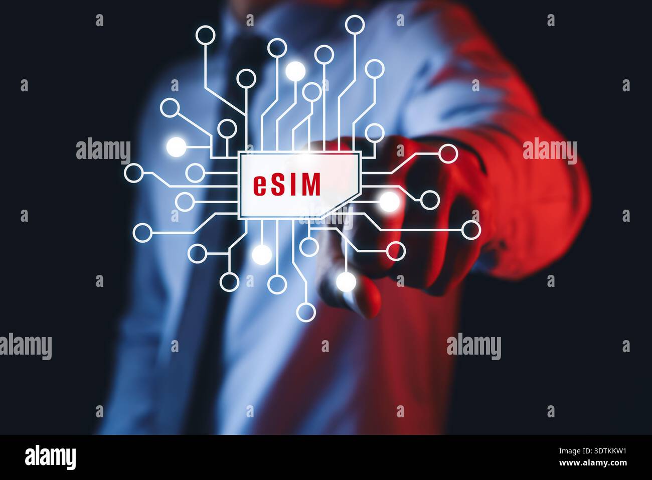 Businessman activating eSIM microchip on virtual screen, closeup. Dark background Stock Photo