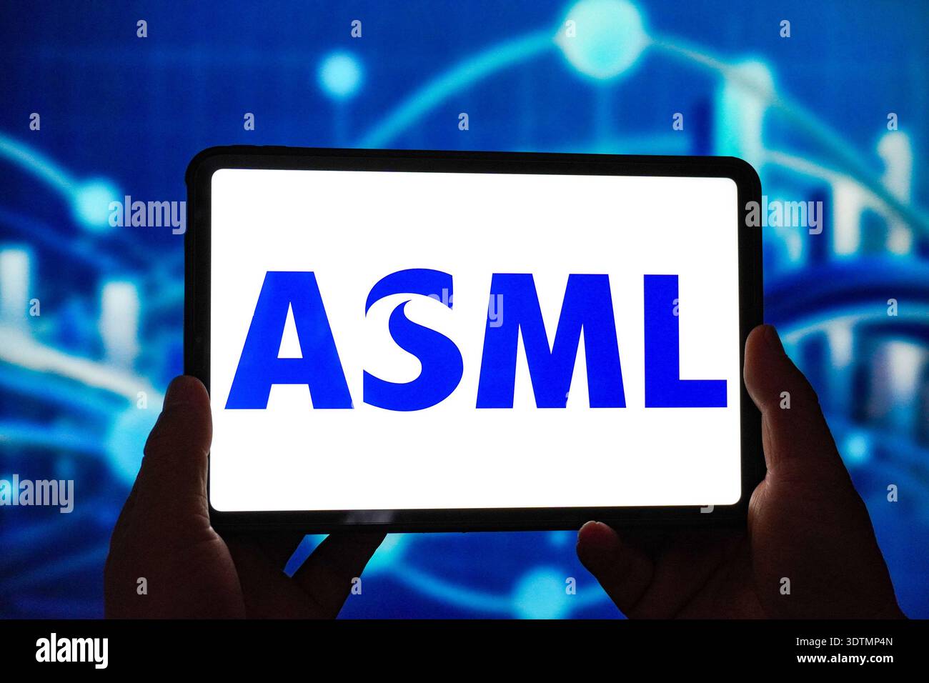 In this photo illustration, the ASML logo is displayed on the screen of ...
