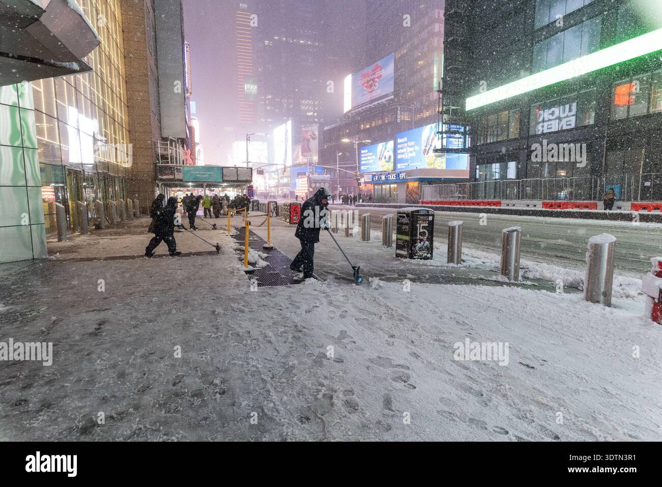 Snow falling on Times Square in New York, NY on February 22, 2026 as ...