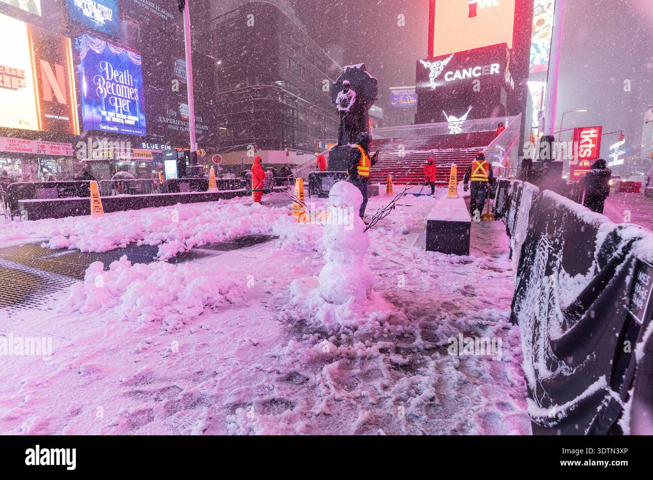 Snow falling on Times Square in New York, NY on February 22, 2026 as ...