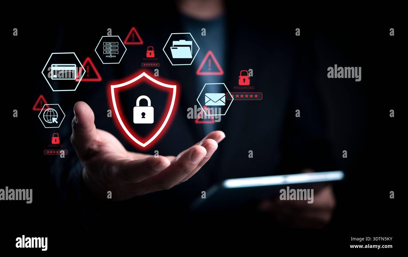 Cybersecurity threat alert concept. Man hand show red shield padlock icon. Data protection network security. Hacker attack warning. Virtual interface Stock Photo