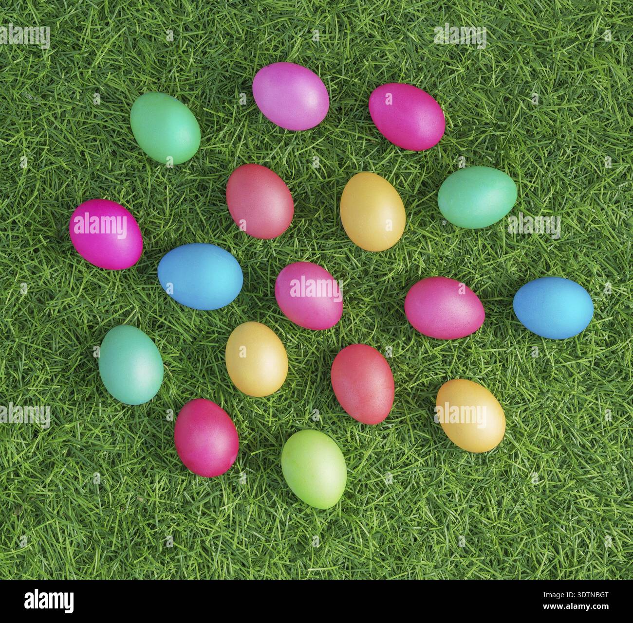 Multicolored easter eggs on the green grass Stock Photo