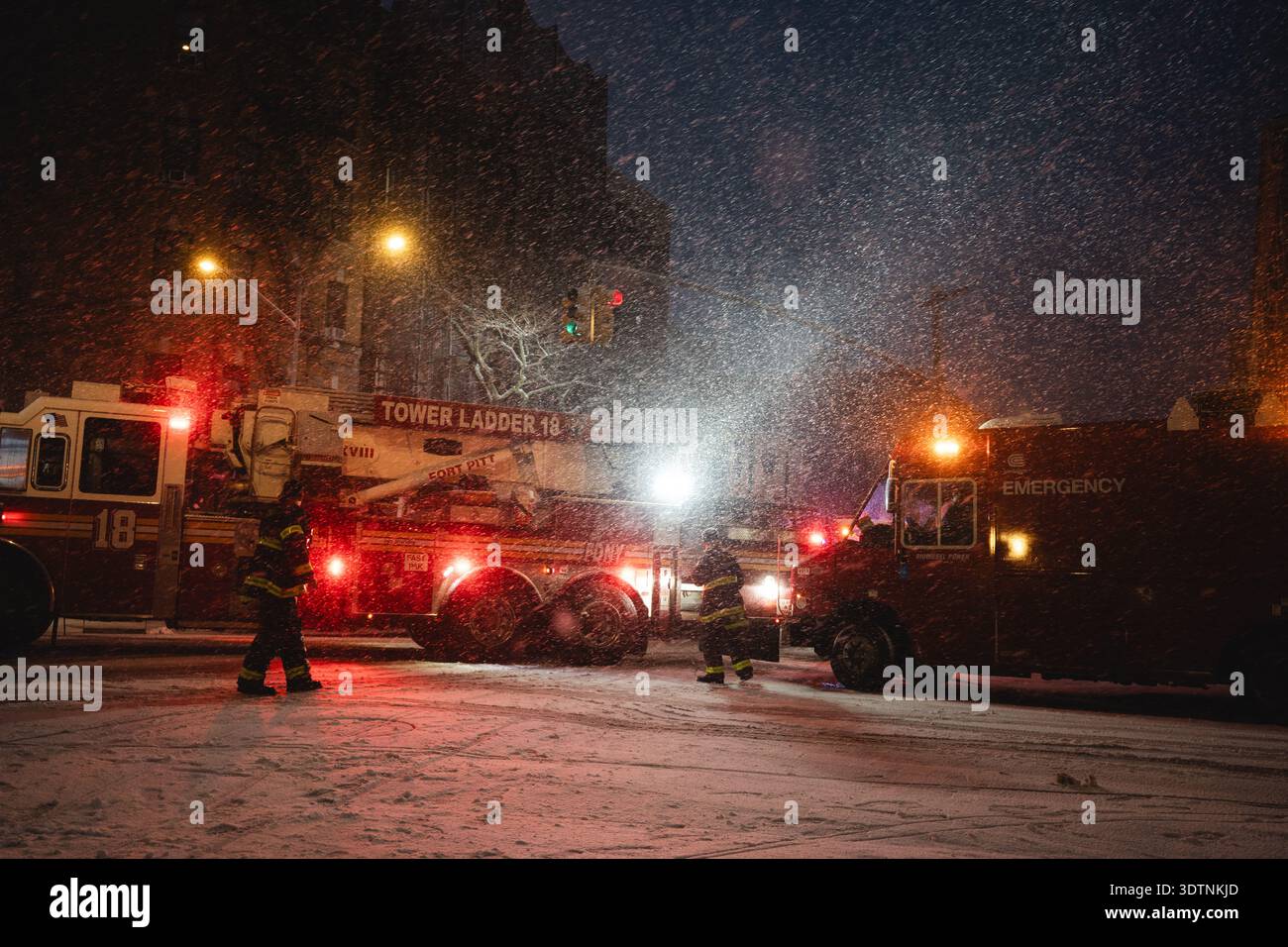 Firefighters from the New York City Fire Department work amid heavy ...