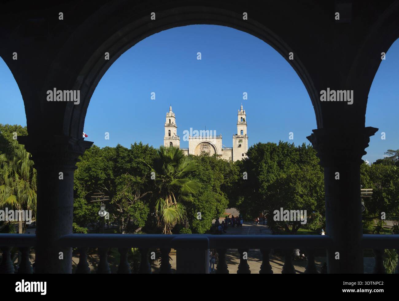 View through arches to the cathedral of Merida over the main square ...
