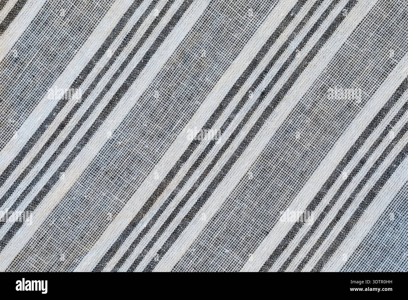 Striped material pattern white and grey diagonal lines. Cotton fabric close up Stock Photo
