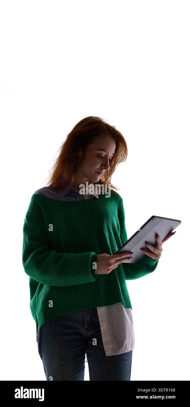 Young woman using tablet isolated on white background. Stock Photo