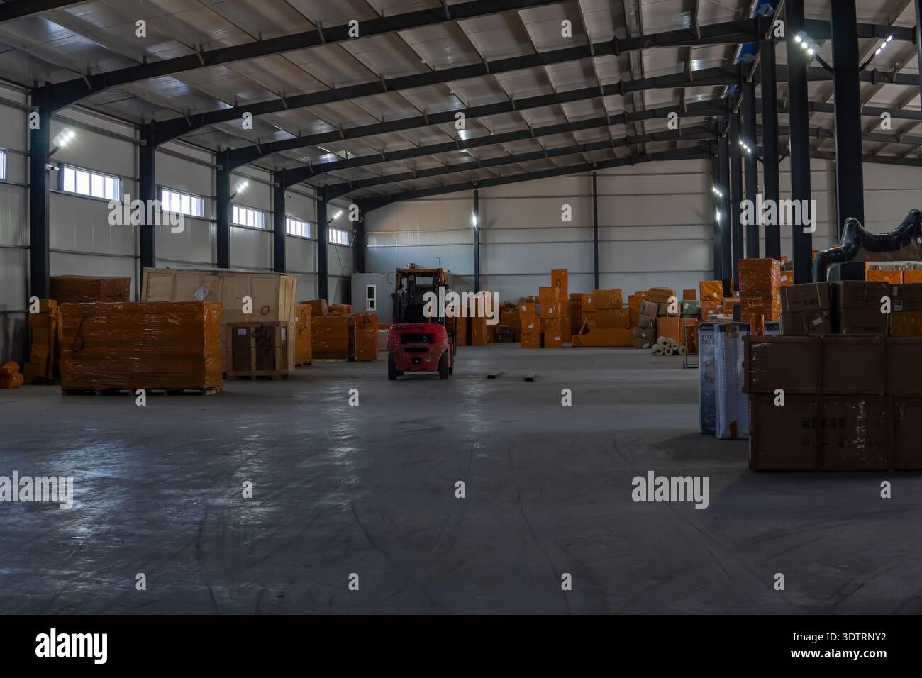 Spacious Warehouse Interior with Forklift Among Stacked Boxes and ...