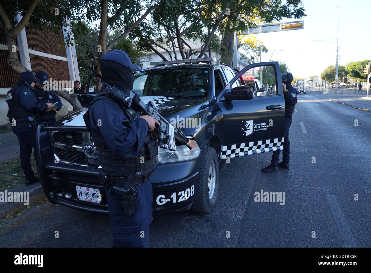 Police patrol Guadalajara, Mexico, Monday, Feb. 23, 2026, a day after ...