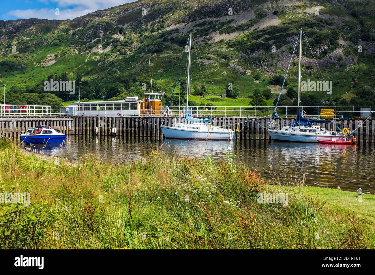 Boats on Ullswater at Glenridding Pier Stock Photo - Alamy