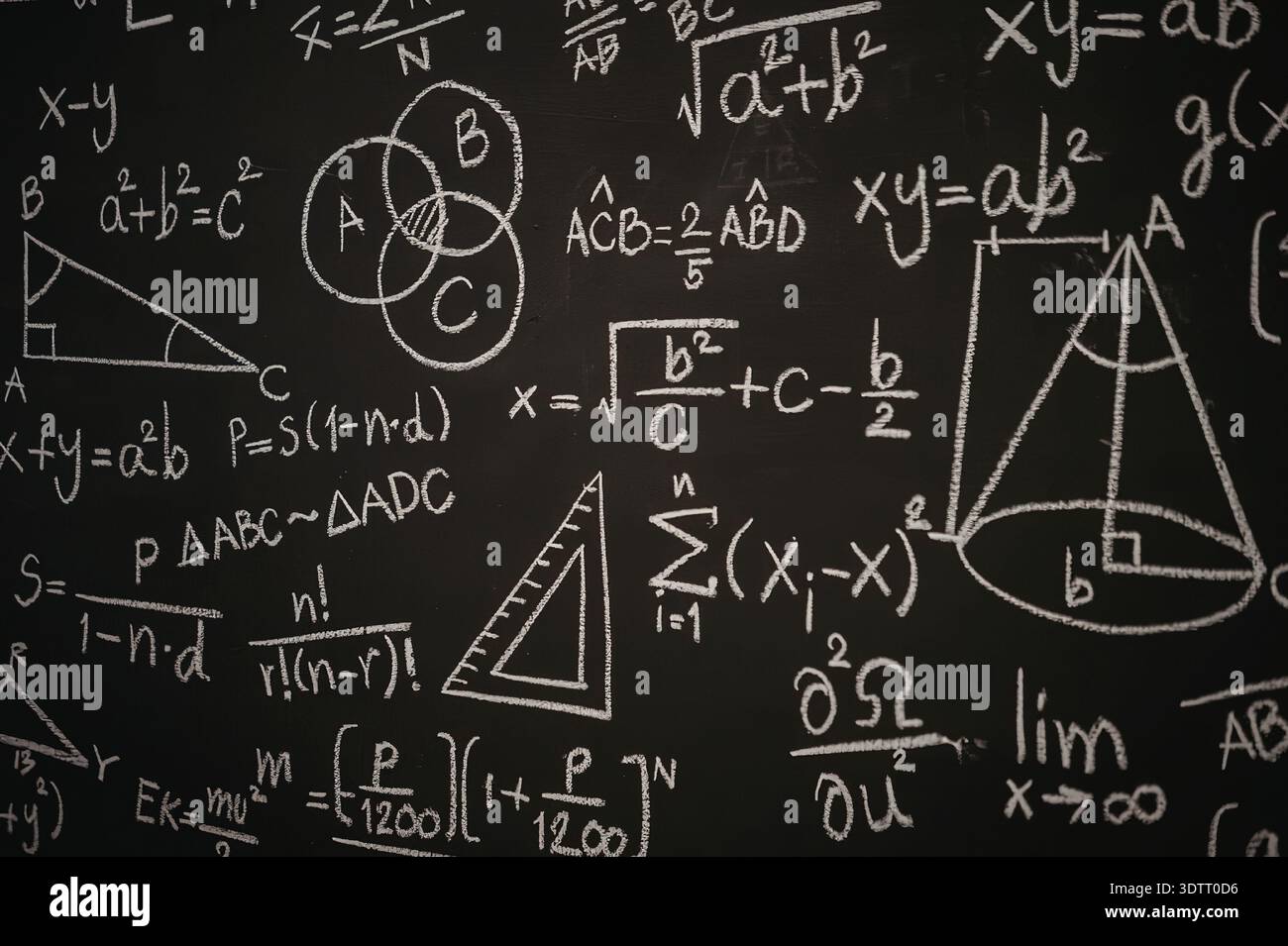 Shapes Making Math Equations A blackboard filled with various mathematical equations and formulas ...