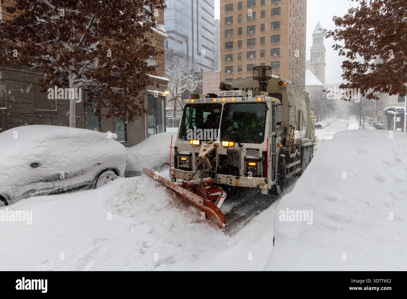 Trucks from the NYC Department of sanitation are seen removing snow ...