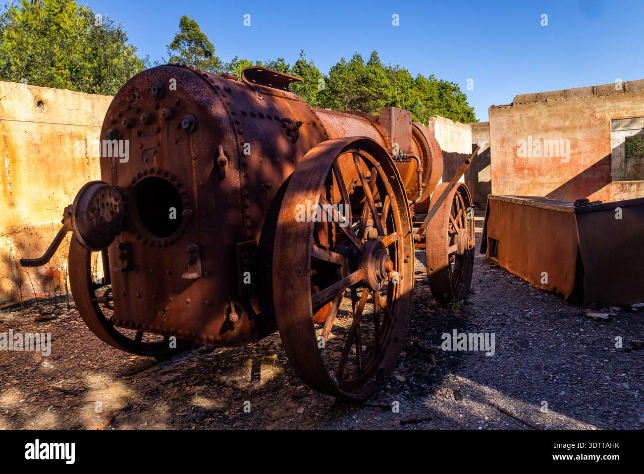 The rusted remains of a 1913 steam locomotive sitting within the burnt ...