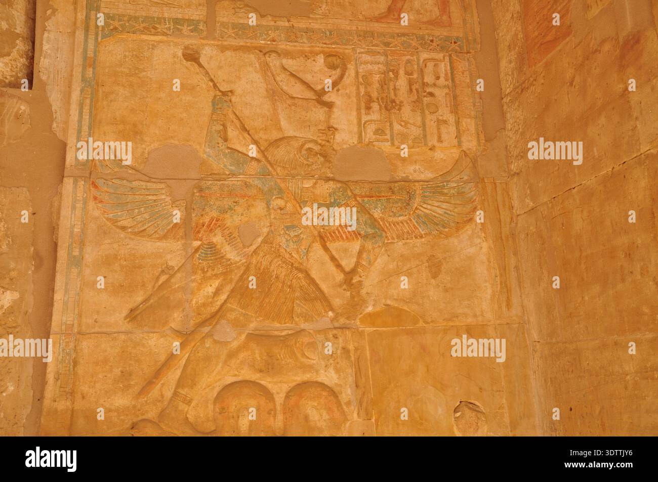 Ancient Egyptian stone relief of a winged deity with original color ...