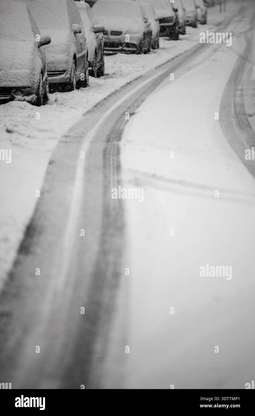 Parked cars covered in snow after heavy snowfall Stock Photo