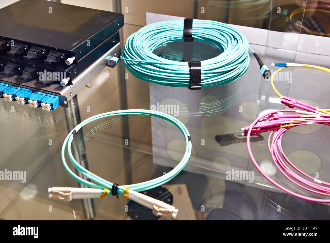 Fiber optic cables with connectors on the switch Stock Photo