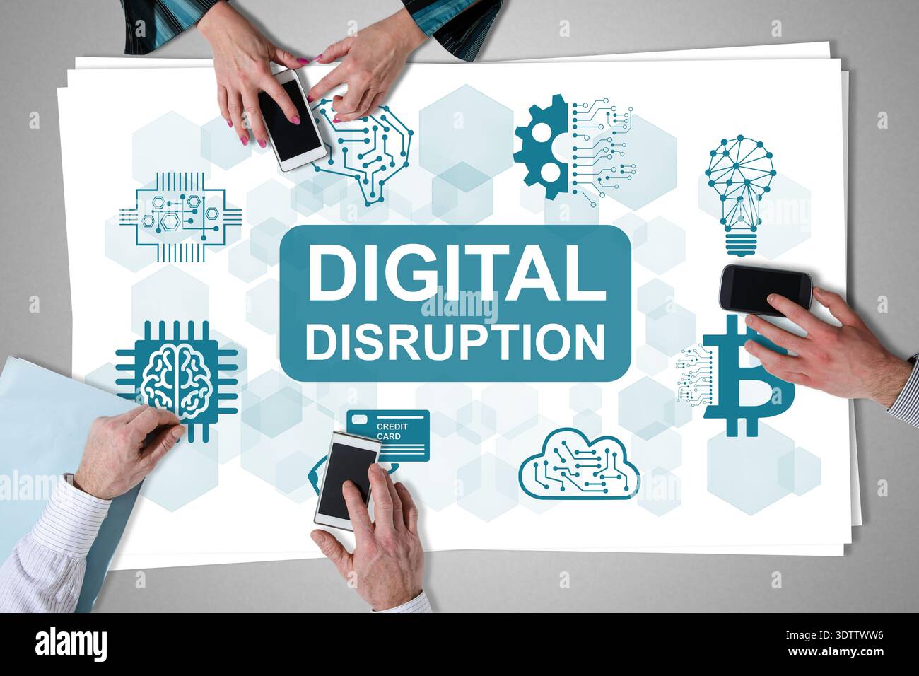 Digital disruption concept placed on a desk with hands using smartphones Stock Photo