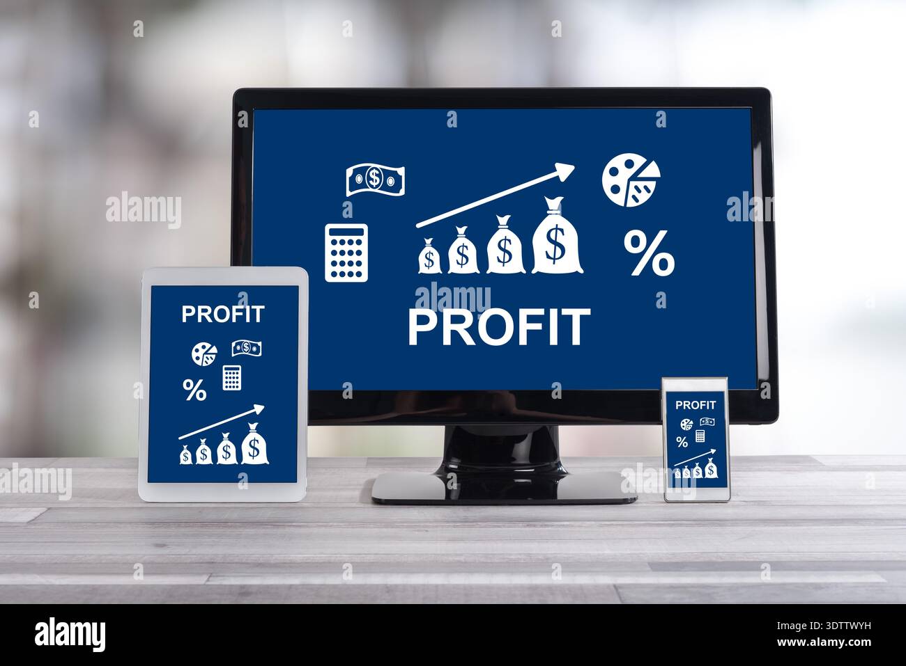 Profit concept shown on different information technology devices Stock Photo