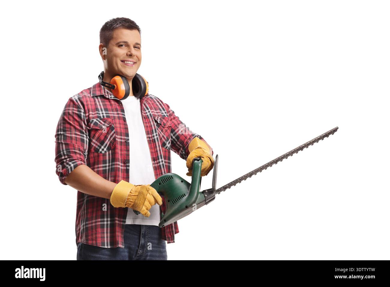 Young man with a chainsaw isolated on blue background Stock Photo