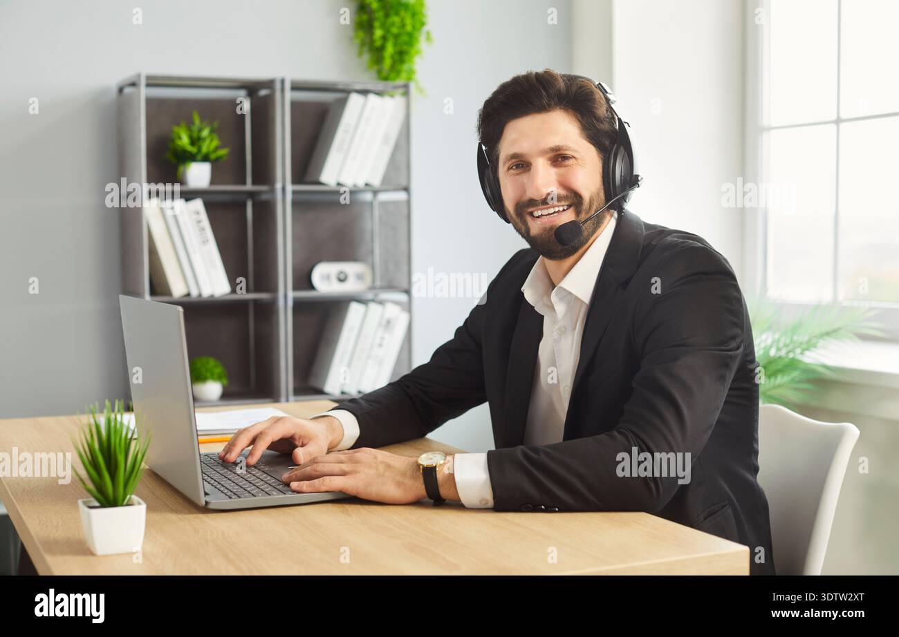 Remote work of call center operator, customer support or businessman with headset in office Stock Photo