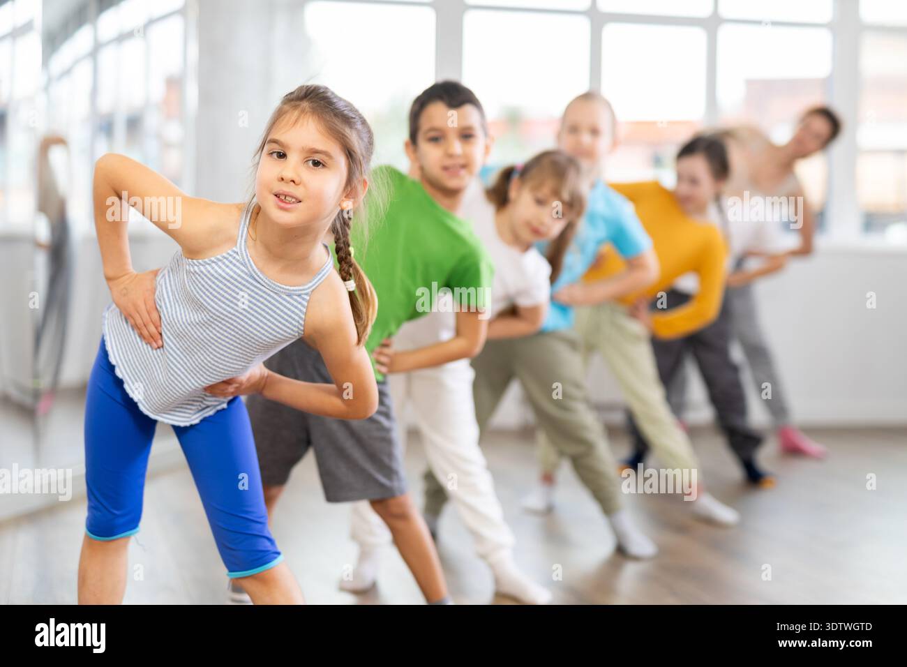 Group of children warming up before dance class Stock Photo