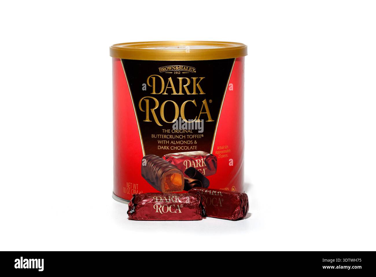 A tin of Brown & Haley Dark Roca, buttercrunch toffee with almonds and dark chocolate. dark almond roca, isolated on a white background. cutout for ed Stock Photo