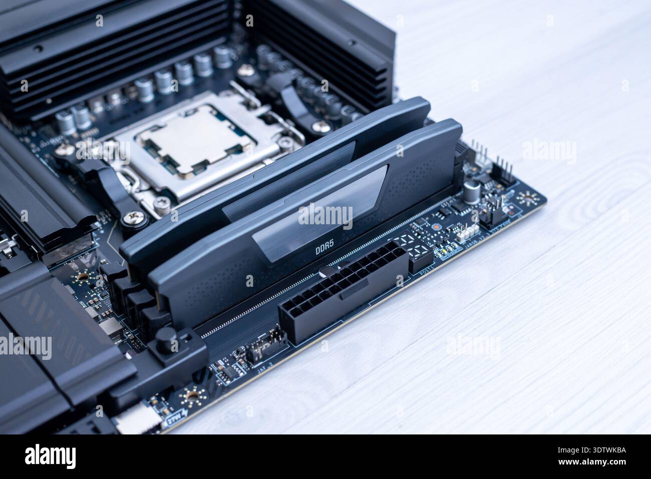 Installed ddr5 memory modules on motherboard, modern computer hardware platform for high speed gaming and workstation computing systems Stock Photo